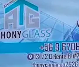 Letrero ATG — Aluminios Thonyglass: casa con vidrio cian