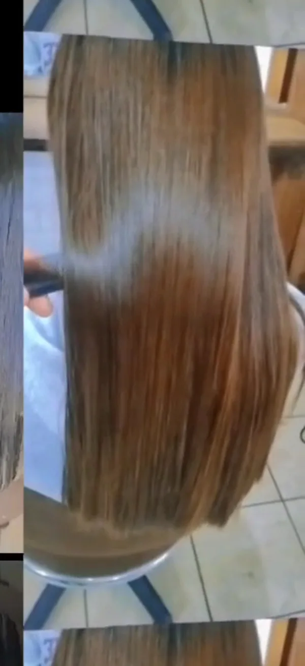Cabello liso oscuro después de un alisado en el salón