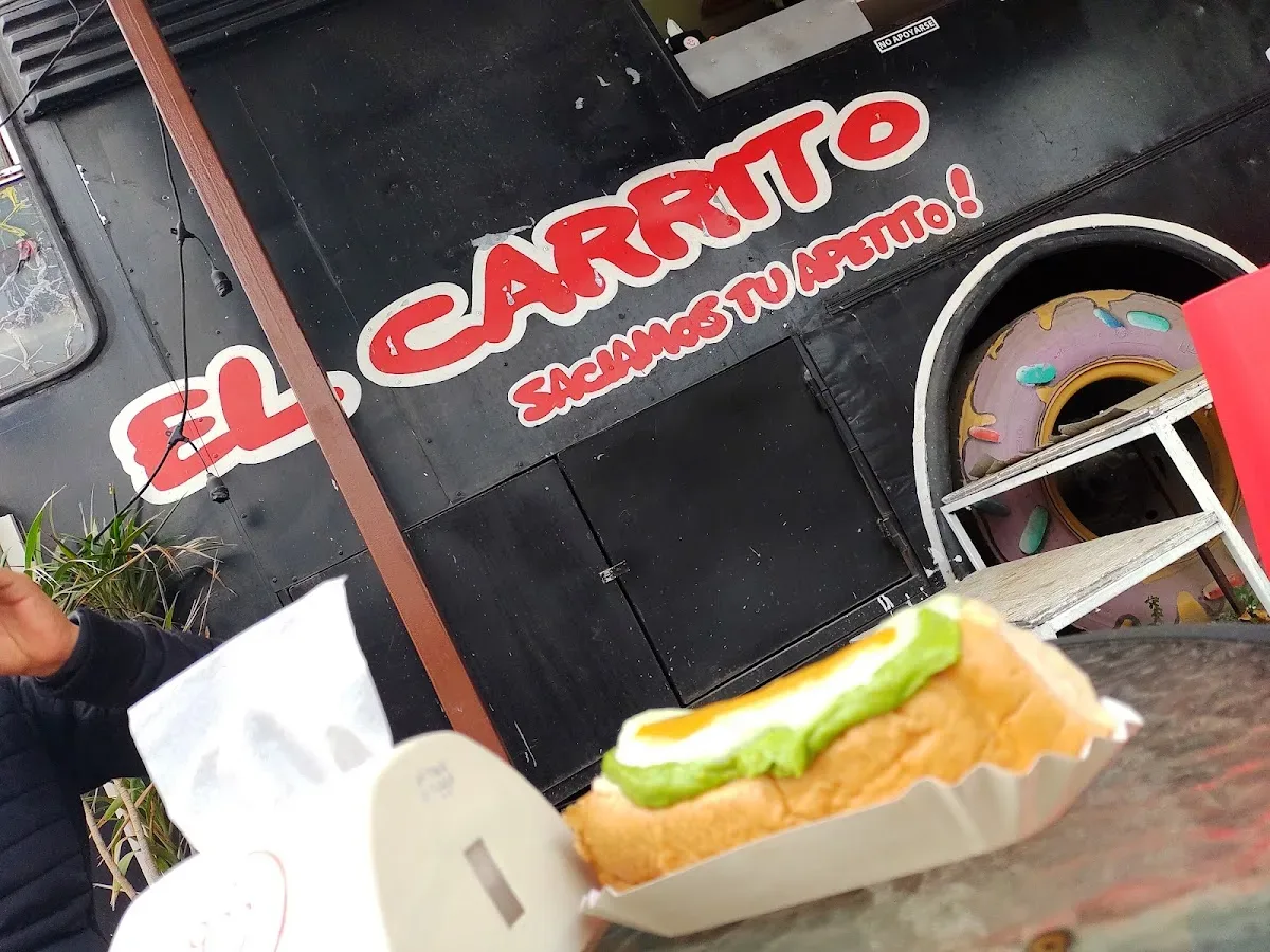 Mural del carrito: logo El Carrito y su lema sacamos tu apetito
